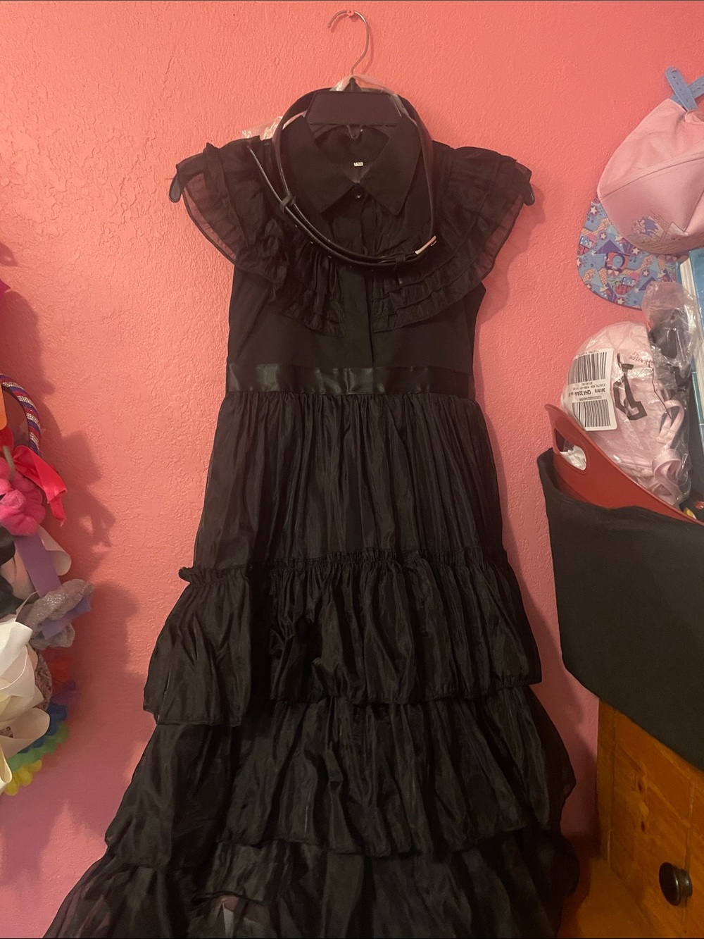Wednesday black ruffle dress with gloves, choker necklace, and waist belt